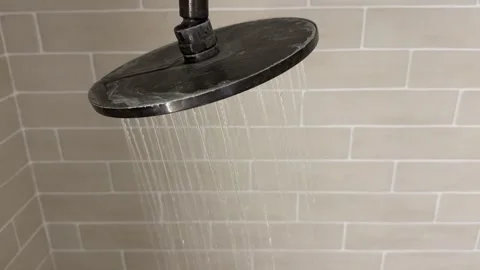 Motion Shot of Water Falling From Shower Head Close-up of turning on water spray Vídeo Stock 262223437