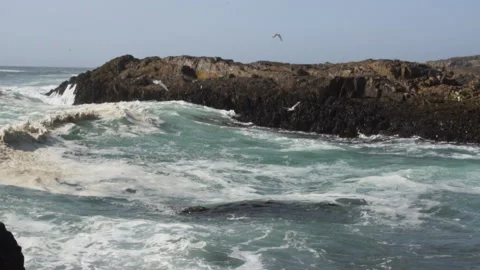 Motion slow motion of waves crashing violently on rocks Video stock 138117222
