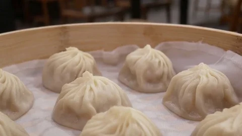 Motion of soup dumpling buns on table inside restaurant Video stock 82955721