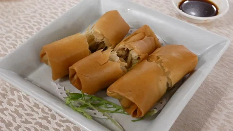 Motion of spring roll appetizers on table inside Chinese restaurant 스톡 동영상 100966999