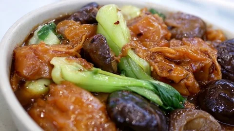 Motion of stewed beef with heavy smoke inside Hon's Chinese restaurant Video stock 69942950
