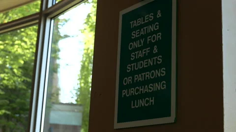 Motion of tables and seating only for stuff and students sign on wall Video stock 94743594