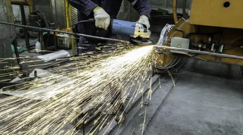 Motion of technician are cutting pipe, Electricity spark from chainsaw, Risk  Stock Photos
