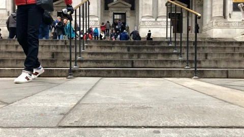 Motion time laps of New York Public Library.
Pan up of tourist and Stock Footage 104754001
