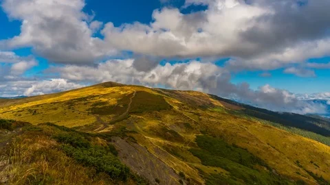 Motion time lapse: Beautiful mountain landscape with clouds. An amazing morning Stock Footage