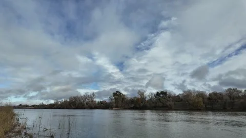 Motion time lapse of clouds over sacramento river winter Stock-Footage 260218828