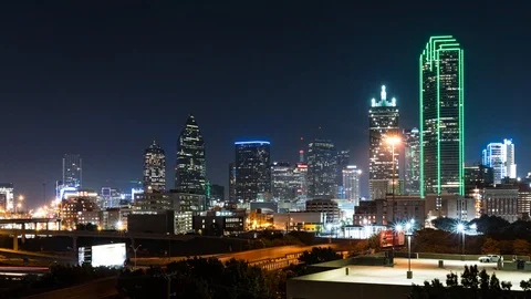 Motion time-lapse of Dallas skyline at night w/long exposure traffic streaks Stock Footage