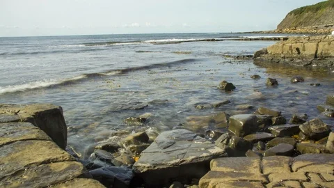 Motion Time Lapse of Kimmeridge Bay, Jurassic Coast, Dorset, UK Stock Footage 94404693