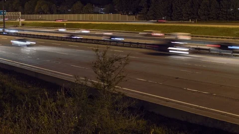 Motion time lapse of night time busy city highway 1 Stock Footage 90088326