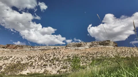 Motion time lapse over Layered Rock Formation and Clouds in the Nevada Desert Stock Footage 314135693