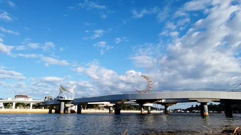 Motion Time Lapse Sultan Omar Ali Saifuddin pedestrian bridge and mosque Stock Footage 100937604