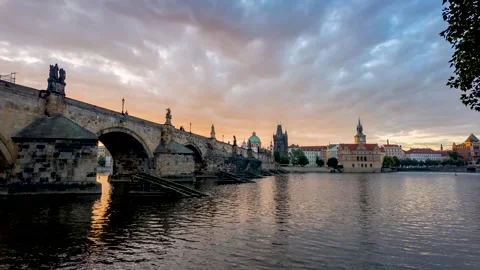 Motion time lapse sunrise view of the Charles Bridge in Prague Stock Footage 278030246