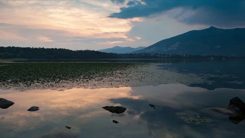 Motion time lapse from sunset to darkness at the lake, Italy Stock Footage 93368490