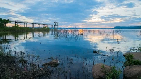 Motion time lapse of sunset at Lum Chae dam, Khonburi, Nakhon Ratchasima, Thaila Stock Footage 99357475