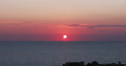Motion Time lapse of sunset over the sea in front of Paola, Calabria Stock Footage 161393974
