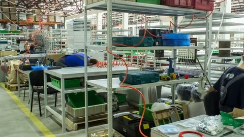 Motion Timelapse along Workplace with Worker in LED Factory Stock Footage 73047665