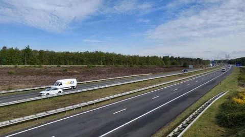 Motion timelapse of Dutch highway a50 shot with sunlight in the back Stock Footage 107366339