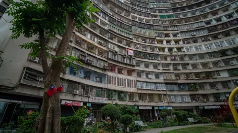 Motion timelapse of old housing block in Kaohsiung Stock Footage 299716750