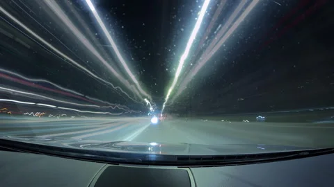 Motion timelapse of a speedy night drive in a big city. Front view from the car Stock Footage 267817831