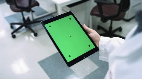 MOTION TRACKING an ipad in a scientific lab walking around looking at data Stock Footage 127533548