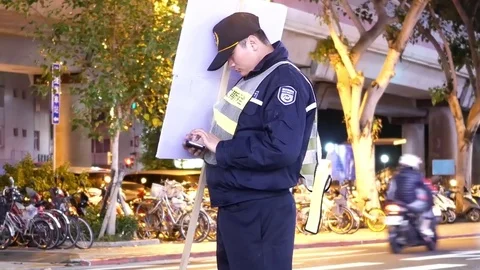 Motion of traffic conductor directing the traffic with sign and playing game Stock Footage 83493595