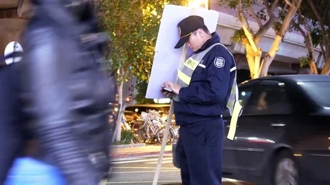 Motion of traffic conductor directing the traffic with sign and playing game 스톡 동영상 83495747