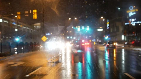 Motion of traffic flow on cold blizzard snow night  with 4k resolution Stock Footage 126813399