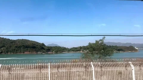 Motion video taken from inside a train seeing the landscape Vídeos de archivo 287587939