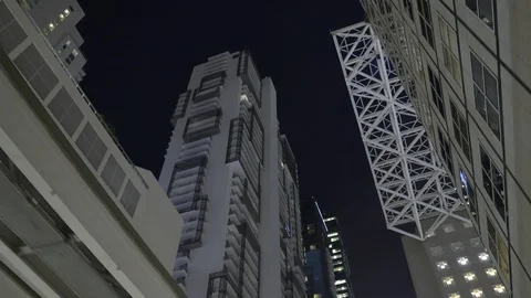 Motion video upward angle towards highrise buildings downtown city Stock Footage 119374543