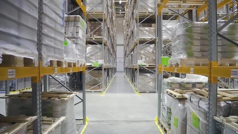 Motion view of interior and shelves with products on industrial warehouse of Stock Footage 127674488