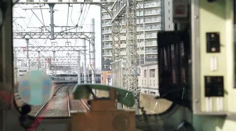 Motion view from the rear window of local Japanese train with classic phone Stock Footage 52542754
