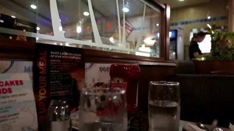 Motion of waitress printing bill for customer inside Denny's restaurant Video stock 71423063