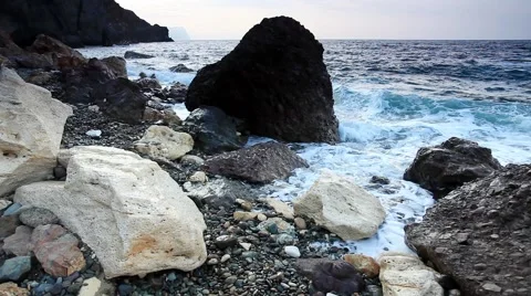 Motion of the waves on the beach. Cape Fiolent, Crimea, Russia. FULL HD Stock Footage 40233094