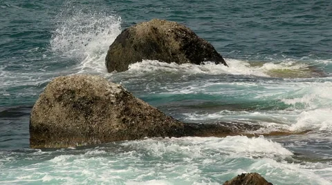 Motion of the waves on the beach. Mountain Meganom, Crimea, Russia. FULL HD Stock Footage 42039851
