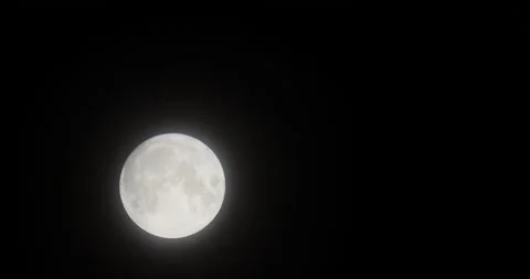 The motion of white full moon close up. The moon passing quickly through the clo Video stock 168182095