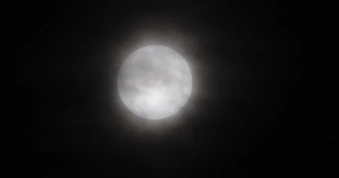 The motion of white full moon close up. The moon passing quickly through the str Video stock 168182214