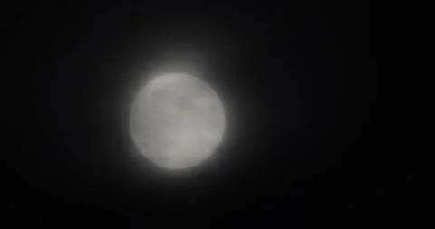 The motion of white full moon close up. The moon passing quickly through the str Video stock 168182215
