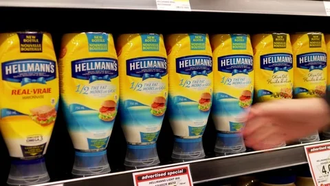 Motion of woman buying Hellmanns light mayonnaise inside buy low foods store Stock Footage 74823340