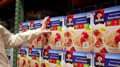 Motion woman buying Quaker instant cereal inside Costco store Stock Footage 75913521