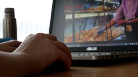Motion of woman using mouse to edit video on laptop with 4k resolution Video stock 68646562