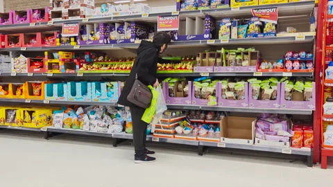 The motion of a woman's hand picking a bunny chocolate Video stock 238457103
