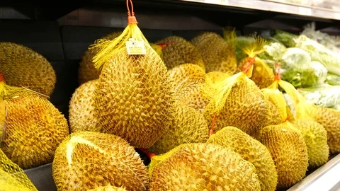 Motion of woman's hand picking durian inside superstore with 4k resolution Stock Footage 79984018