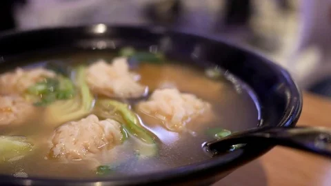Motion of wonton soup with smoke inside restaurant Stock Footage 75364744