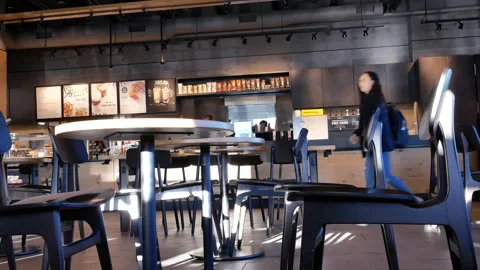 Motion of worker cleaning counter inside Starbucks store with 4k resolution. Stock Footage 91713988