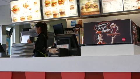 Motion of worker cleaning food track inside A&amp;W restaurant with 4k resolution. Stock Footage 126030125