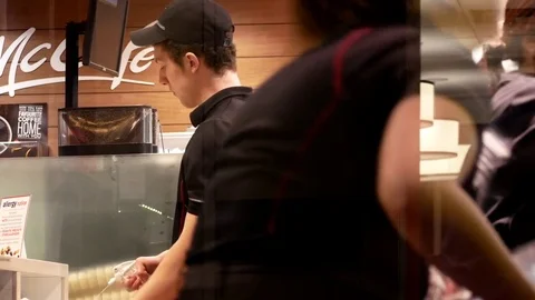 Motion of worker making foods for customer at mcdonalds Stock-Footage 73287251