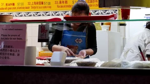 Motion of worker making steamed buns inside mall with 4k resolution. Stock Footage 71263802