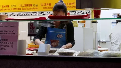 Motion of worker making steamed buns inside mall with 4k resolution. Stock Footage 71278383