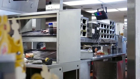 Motion of worker preparing burger for customer inside Burger Kings Stock Footage