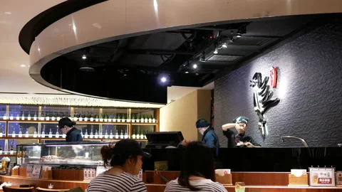 Motion of worker preparing food for customer inside Japanese restaurant Stock Footage 96821943